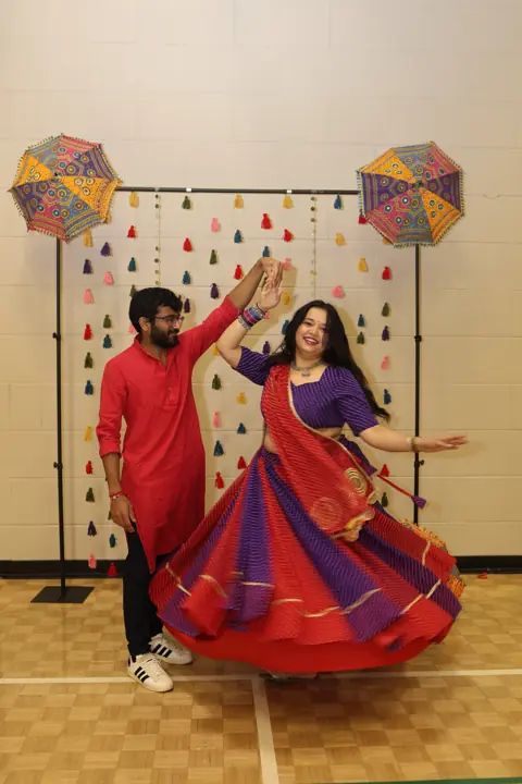 Guests posing together in colourful traditional clothing