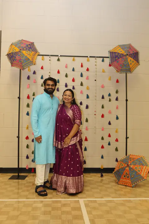 Guests posing for a photograph at the Navratri celebration