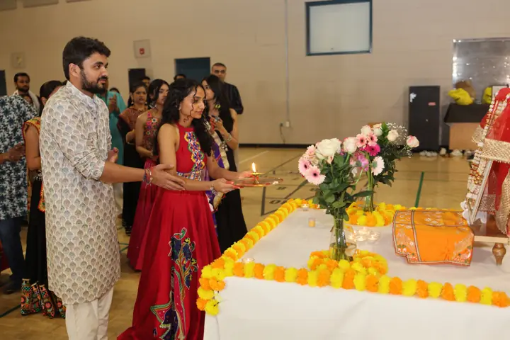 Guests gathered around a decorated ceremonial table