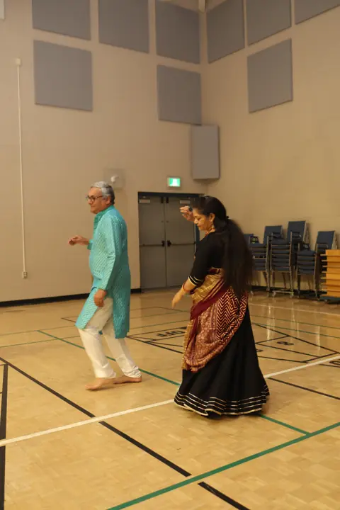 Guests dancing together in the event hall