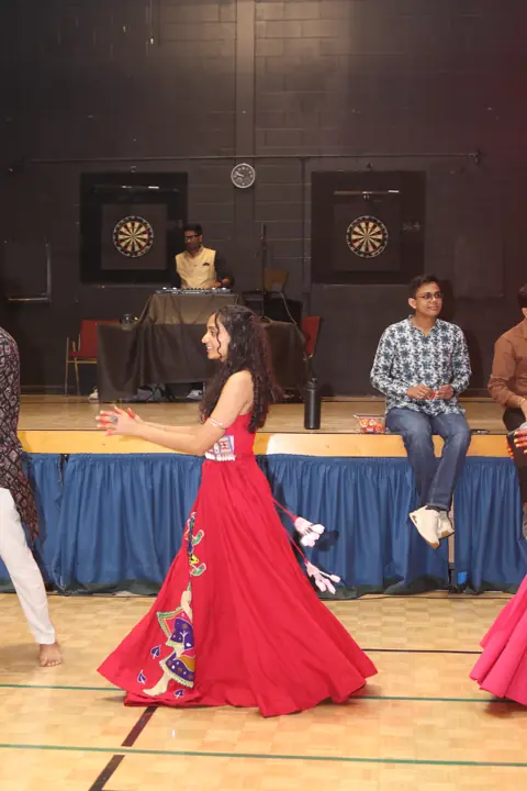 Guests dancing beside the stage during Navratri