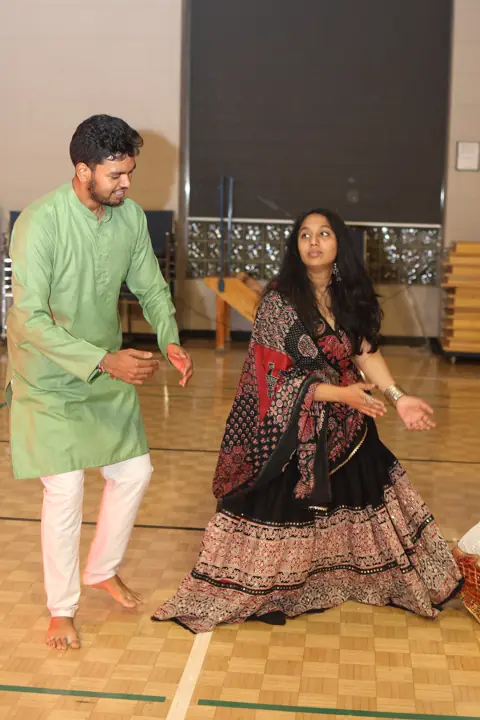 Guests dancing together in traditional clothing