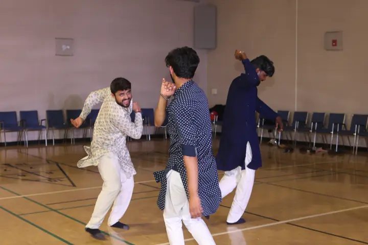 Guests sharing a lively moment on the dance floor