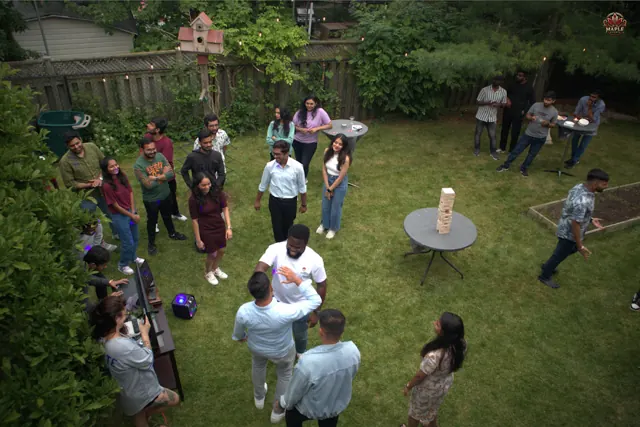 Guests mingling at an outdoor garden celebration