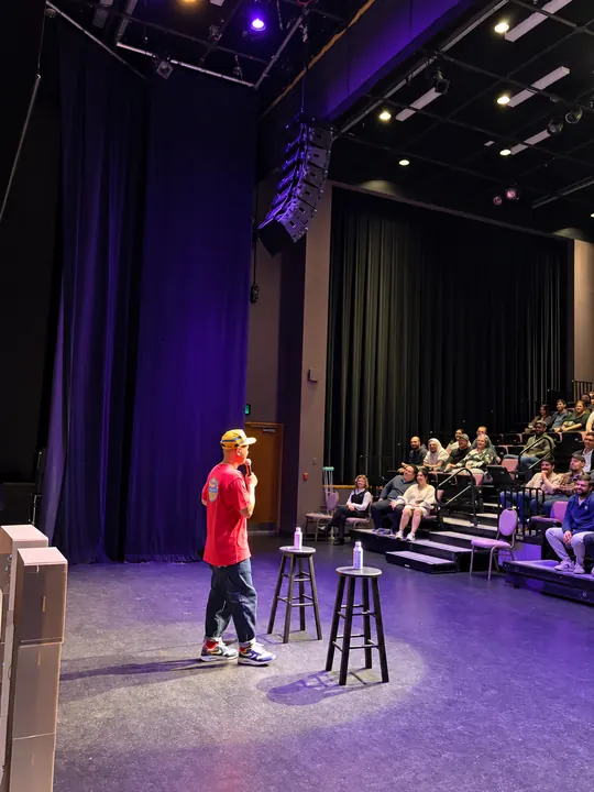Performer on stage with the audience at Roll on the Floor